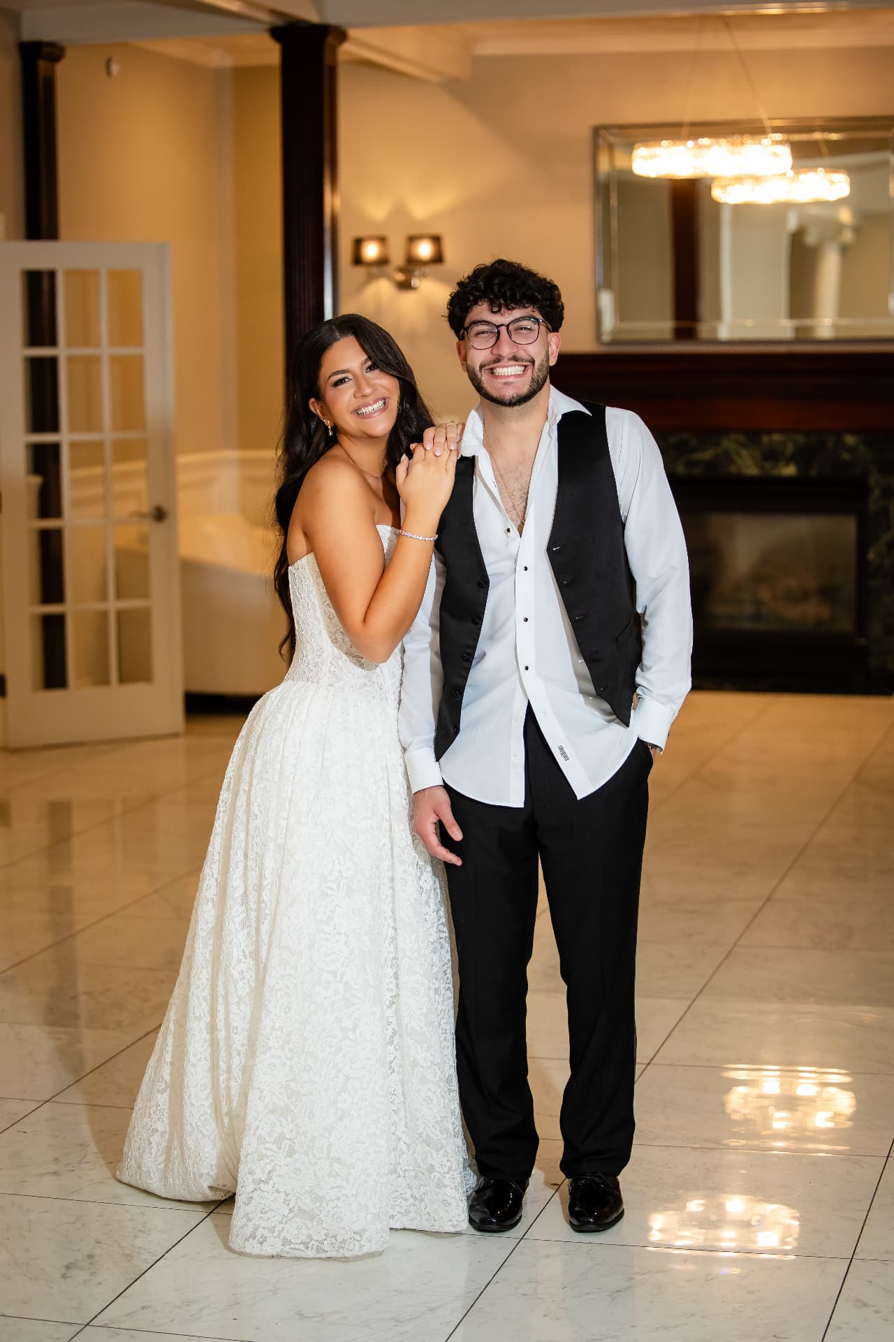 Wedding couple celebrating together inside their reception venue